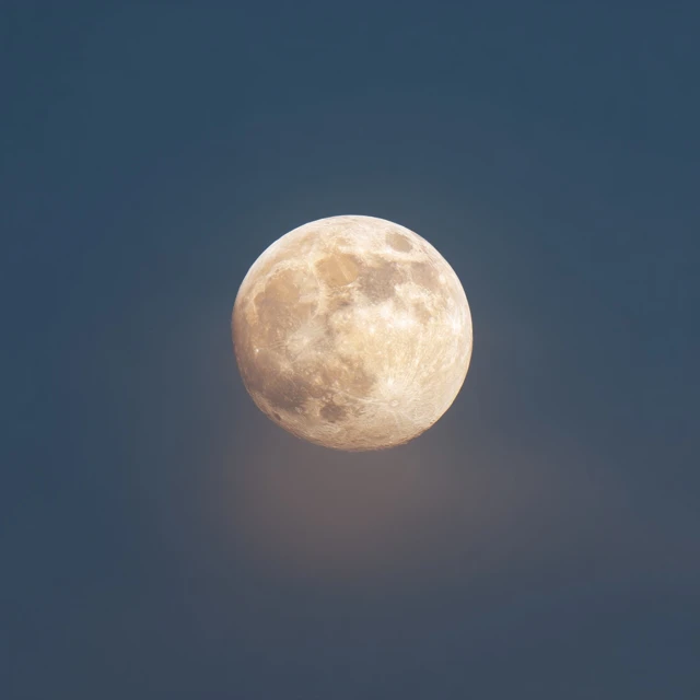 Full Moon Against a Dark Blue Sky